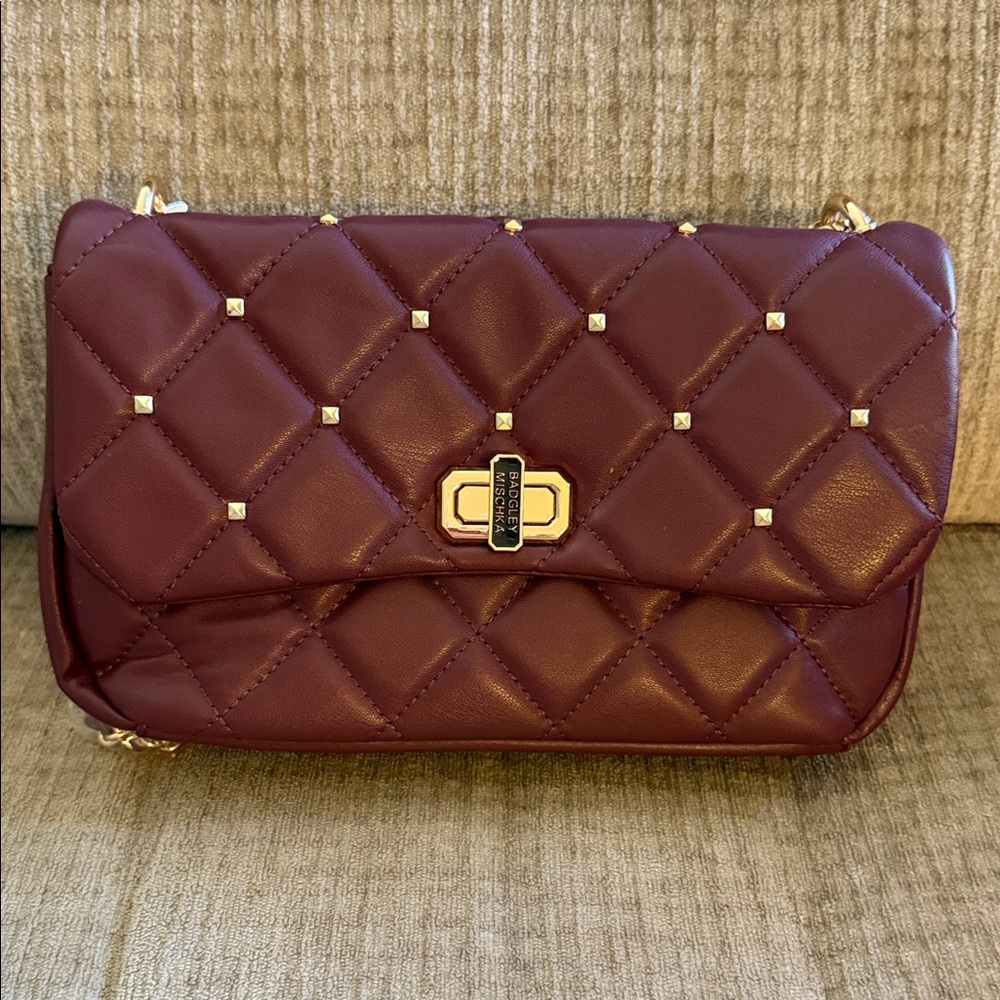 Baffled Mischka Vegan crossbody with diamond quilted and studs on cover Apx10